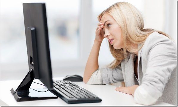 Stressed Businesswoman With Computer At Work
